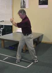 Slowly begin your backswing rotating your arm back in a wide arc.