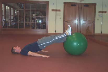 Ball Bridge Goal: This movement is designed to strengthen the low back muscles and glutes.