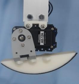 A Touch sensor on the foot. Fig. 5. SAT(Stiffness Adjustable Tendon) used in this research A. Model of biped walking robot Figure 1 shows the model of the walking robot.
