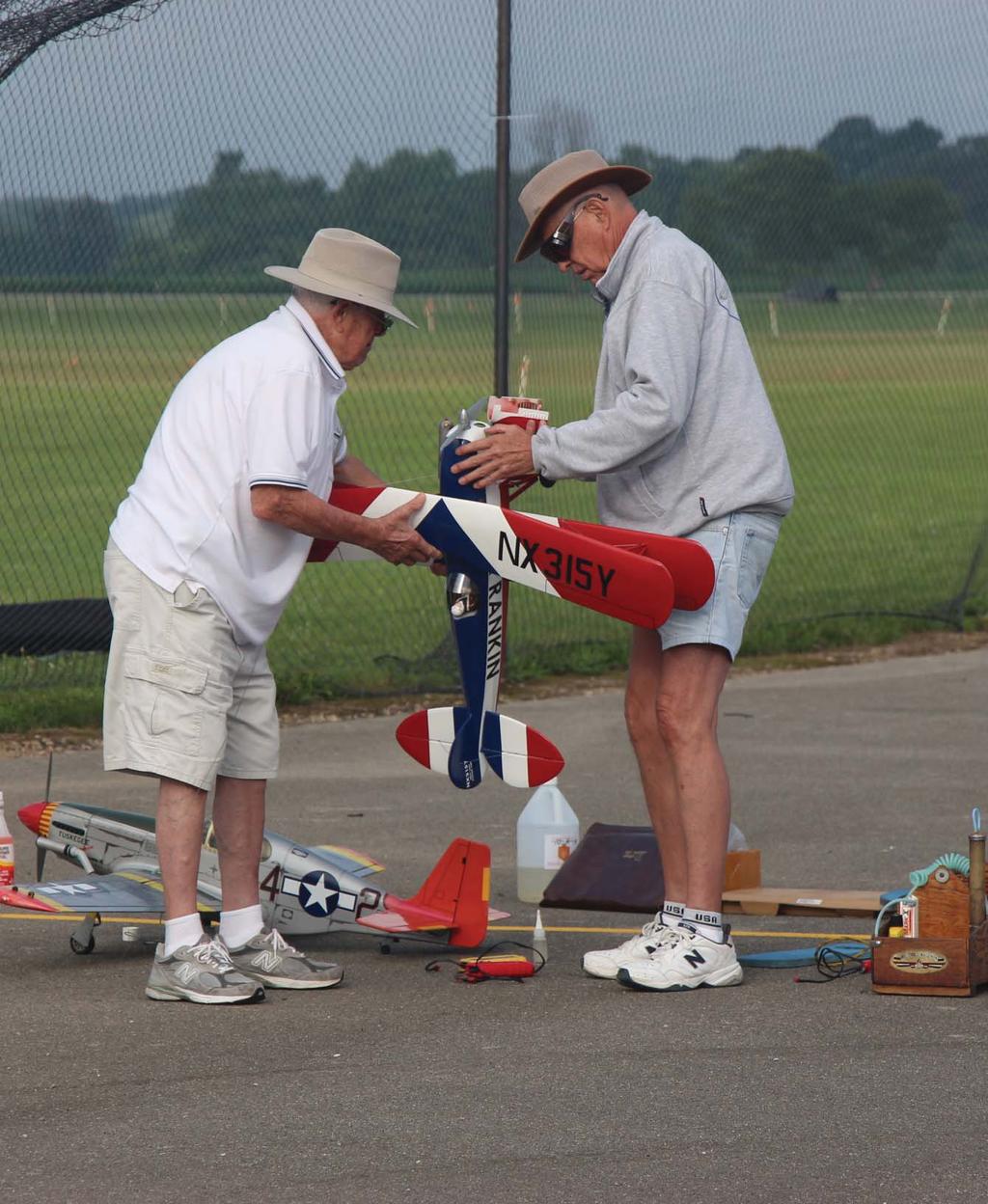 Victor and Burt getting the Great Lakes Biplane ready for flight.