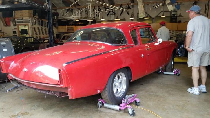 The pictures show a 1957 Ford Fairlane in the process of getting a full restoration,