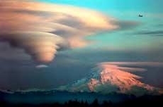 Lenticular clouds may form in mountain waves, as shown in the figure on the right side of this page.