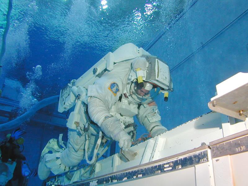 Application Problem: Getting the Astronaut Neutrally Buoyant in the Pool For this problem we can use the unit kilogram force (kg f ) to represent force.