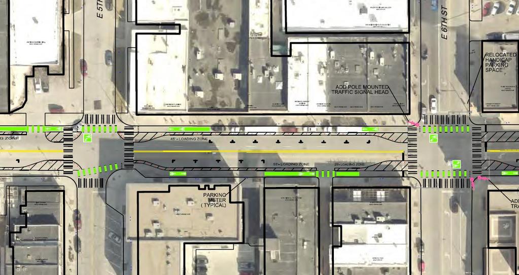 E Grand Complete Street Pilot Project Design Elements Two travel lanes Parking protected bike lanes / Green Conflict