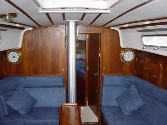 6 9) Interior - Cloth fabric is used for the main saloon berths and matching vinyl for the quarter berth and forepeak berths.