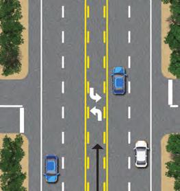 You may turn from a side street or driveway into a two way left turn lane and stop to wait for traffic to clear before moving into the lane to your right.