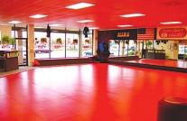Typical Mile High Karate AVERAGE FACILITY SIZE: 2,000 2,500 square feet. WARM-UP AREA 8 6 DRESSING 13 DRESSING Floor Plan 7 4 5 BATHROOM F L O O R P L A N Typical Mile High Karate studio interior.