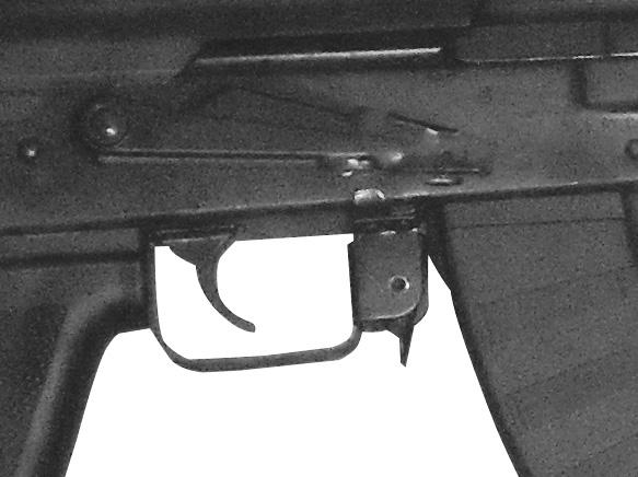 Install the loaded magazine into the rifle by tilting it rearward, then inserting the catch surface at the front of the magazine into the magazine well of the receiver so that it latches on the