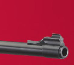 Ejector mechanism provides maximum leverage at the point where the ejector engages the cartridge case and can be adjusted to provide extraction only.