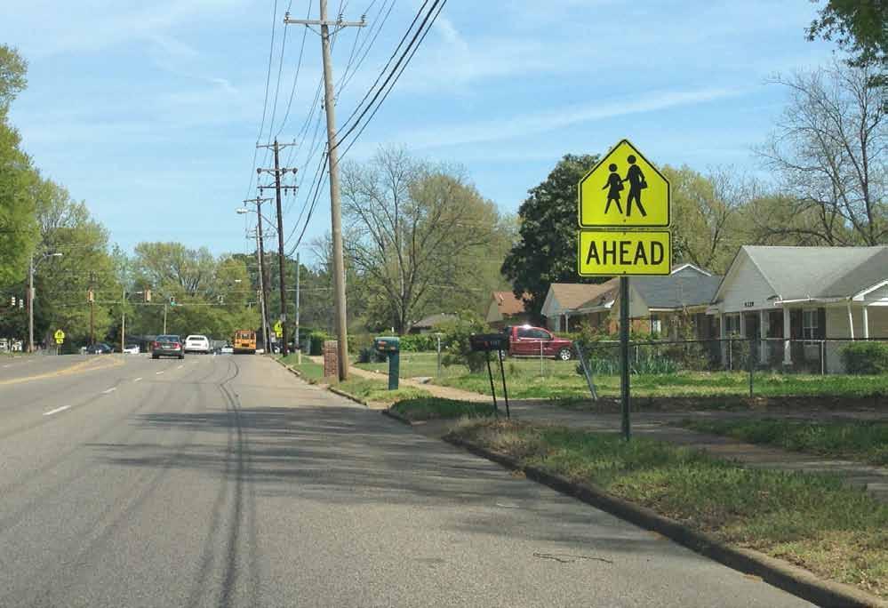 warning signs within school zones and may also be beneficial at other marked