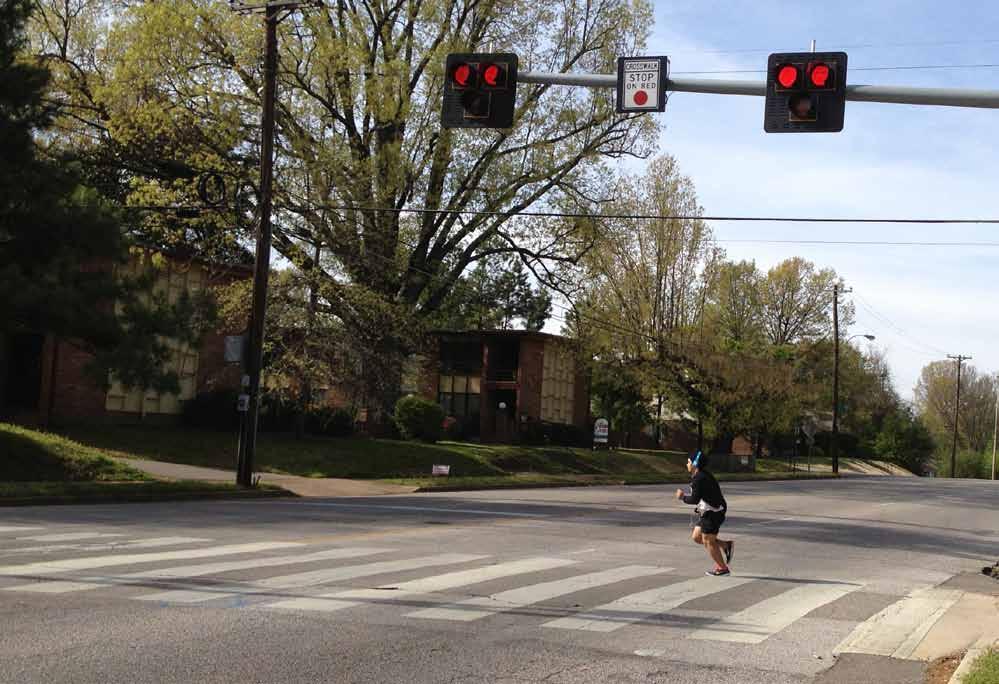 A median with an integrated pedestrian refuge near Frayser High School allows people to cross one direction of