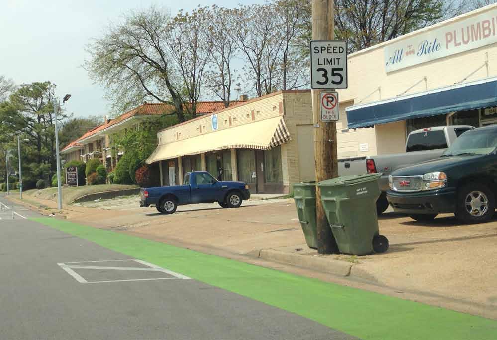 Similar to this green paint treatment that suggests bicycle priority at driveways, sidewalk design can help visually
