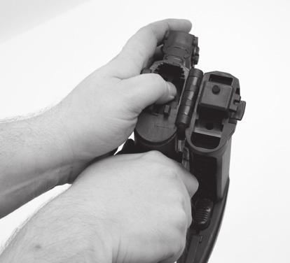 Pull down on the lower receiver while holding the safety lever in the disassembly position and depressing the