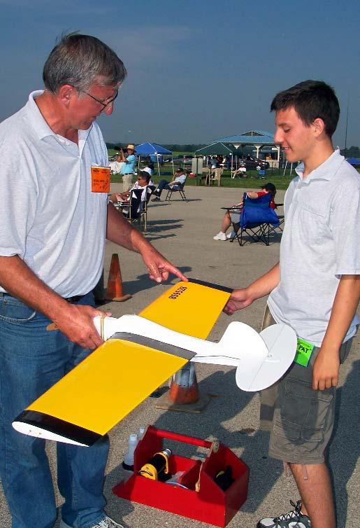 Allen Brickhaus Patrick Gibson (R) and his father discuss strategy in preparation for their flights on Friday morning.