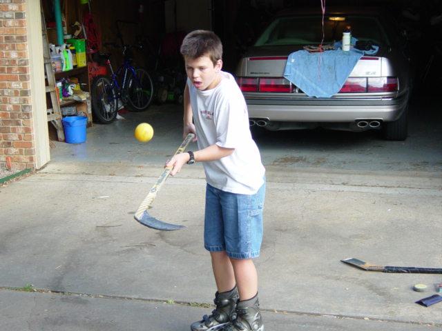 The player should develop where they can bounce the ball and skate at the same time, and once they can keep the ball in the air skating forward they can try it while skating backward.