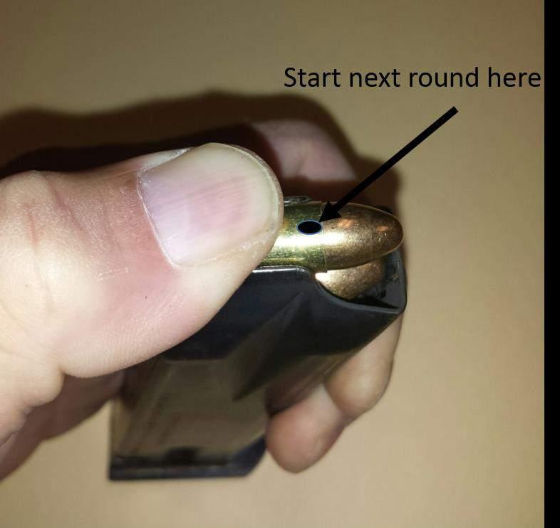 Insert additional cartridges similarly. It is easiest to push down with the new cartridge just ahead of the feed lips and behind the end of the case mouth of the cartridge already in the magazine.