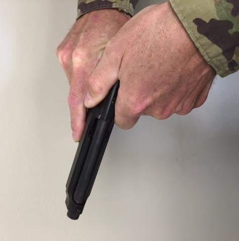 Press it firmly into the pistol with the palm of the hand while listening for an audible click. This is the magazine catch engaging the magazine.