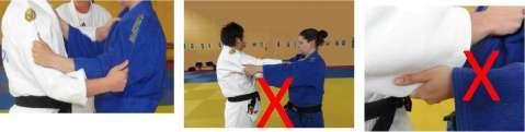In order to indicate to the athletes that they must adjust their judogis, the referee will approach and face the judoka, take his/her forearms and cross them in the conventional way.