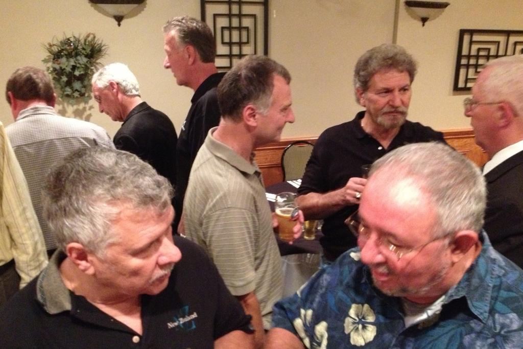 Foreground: First time reunion attendees Paul Kircher and Lou Castioni catch up while Jerry Kenny, Ray Porcell, and Mike O Grady share