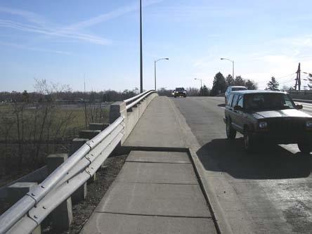 visibility and low guardrail on the bridge embankment makes pedestrian and bicycle
