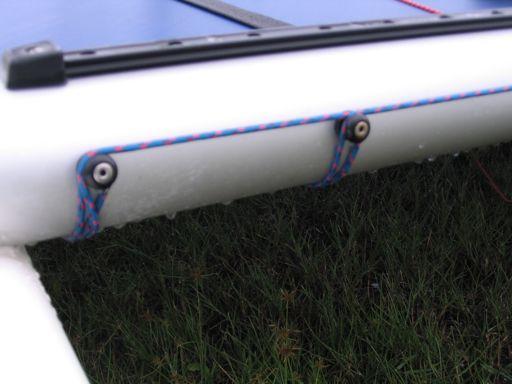 With the 1, 25 foot long piece, tie a loop and wrap around one end of the tramp tie rod.