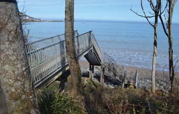 Continue down towards the beach taking care as the path can be muddy and slippery. Then take the metal steps on your left to enjoy your first experience of the stunning Traethgwyn beach.