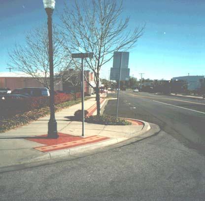 Bulb-Outs Description: The lane is narrowed at an intersection or mid-block by extending the curbs on one or both sides of the street toward the center of the roadway or by building detached raised