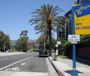 Use signs, pavement markings, and traffic calming measures to discourage through trips by motor vehicles and provide cyclists with enhanced crossing of arterial streets.