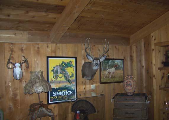 The trophy room has a rustic appearance with