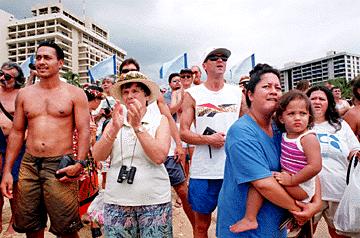 By Kathryn Bender, Star-Bulletin Crowds cheer the arriving teams on Oahu.