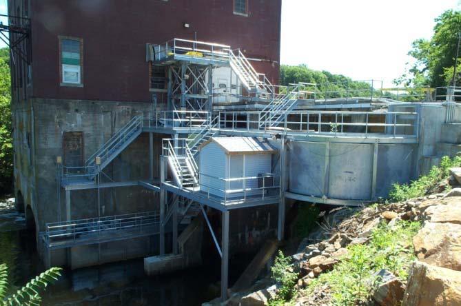 When activated, the hopper rises, capturing all accumulated fish and water, and travels vertically to the headpond level, where it discharges its contents into an exit flume that provides fish a