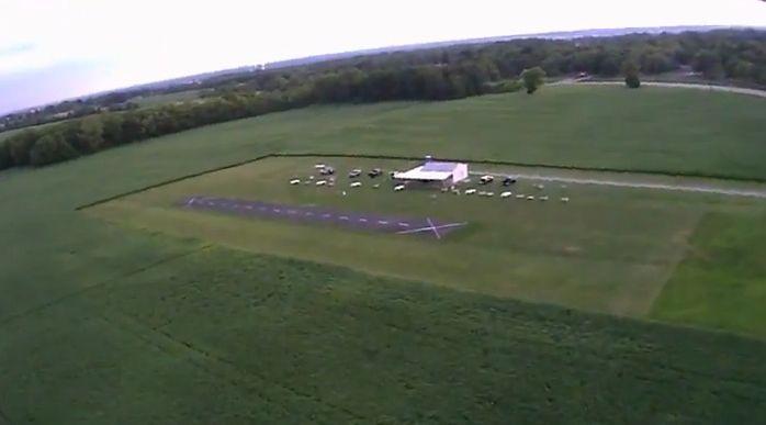The club has about 150 members, charges $50 annual dues, and they pay someone to mow the grass areas around the paved runway. Above is a view of their club house and covered picnic table & patio area.