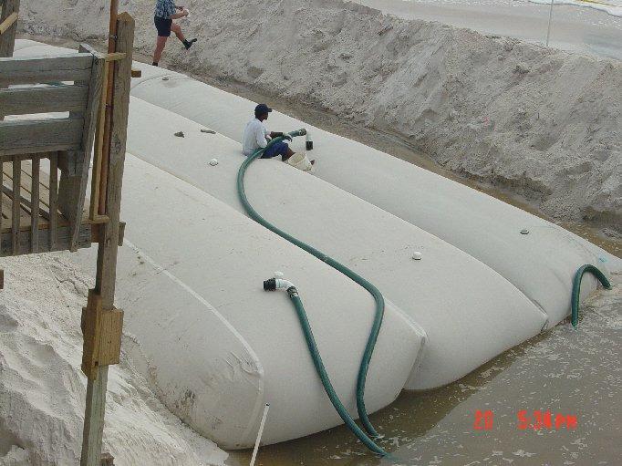 costs and less need for heavy equipment, sand-filled containers have been used in developing countries (HARRIS and ZADIKOFF, 1999).