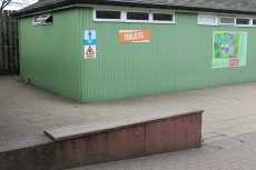 Ramp down to main toilets Access to ladies toilets Top toilets first seen by guests