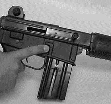 NOTE: If the firearm is not cocked, the safety cannot be set on SAFE. 2. Remove the magazine by pressing the magazine catch button (L-5) and pulling the magazine down out of the receiver.