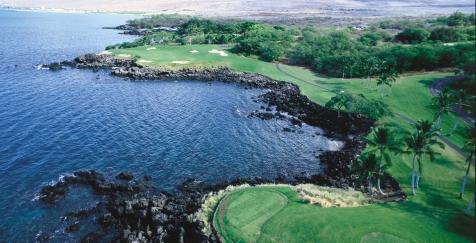 The signature third hole at the Mauna Kea Golf Course is a long par 3 over the Pacific Ocean. an adventure.