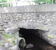 An old stone box culvert is present just east of Mechanic