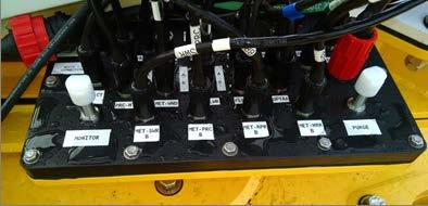 Remove plastic caps from the Monitor and Purge ports on the instrument well junction box 2.