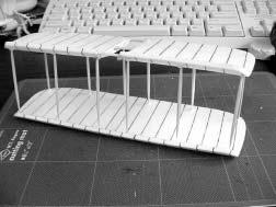 4. Use the wing template and a sharp toothpick to mark the holes for the spars on the top surface of the lower wing and the bottom surface of the upper wing.