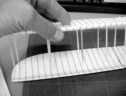 6. Use the wing template and a sharp toothpick to mark the holes for the spars on the top surface of the lower wing.