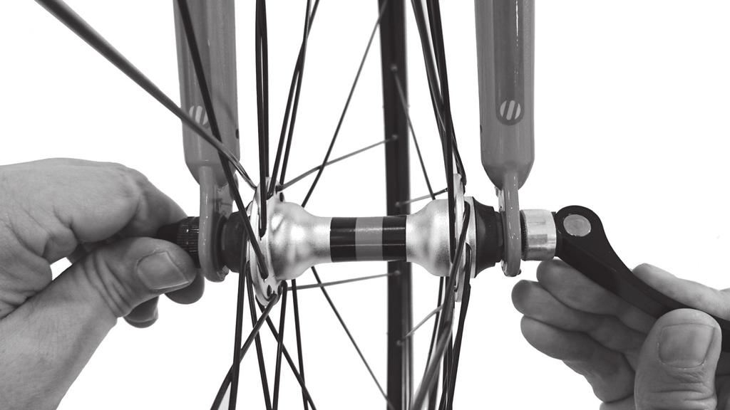 To check, simply push your thumb hard onto the tire or use a pressure gauge fitted to most quality bicycle fl oor pumps. If you can touch the rim this probably needs some more air. a. Put front wheel into the fork.