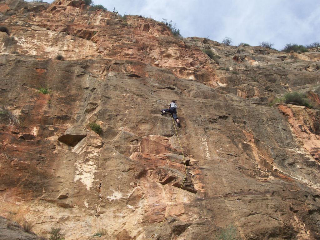 Leave the path for the multipitch routes and keep below the rock face.