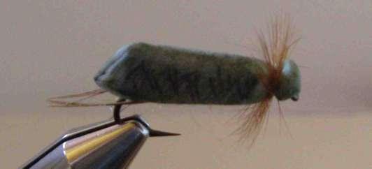 Since the hula skirt material is flat rather than round like mono, it sits on the hook very well and won t roll. Flies Traveling Sedge made with fire proof fingers.