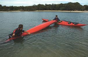 back. Suction from air trapped in the cockpit can make the overturned kayak difficult to lift clear