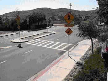 Figure 10. Typical Median Refuge Island at Mid-Block, with At-Grade Passage for Crosswalk.