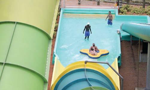 When dispatching riders at the top of a slide: Help riders into the ride vehicle or opening of the water slide, ensuring that they are properly positioned, providing verbal safety reminders and