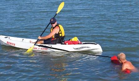 USING WATERCRAFT FOR RESCUES Rescue with a Non-Motorized Water Craft Kayak 1 2 3 Extend the rescue tube to a distressed swimmer or active victim.