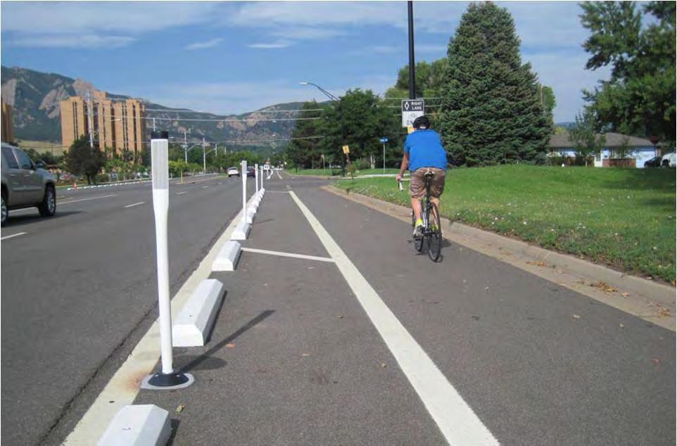 (Source: City of Boulder) Parking stops and similar low linear barriers are inexpensive buffer solutions