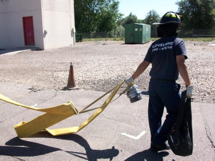 #2 The Firefighter deploys the hydrant bag and LDH from the hose bed and drags it to the hydrant nearby (Fig. 2). Fig.