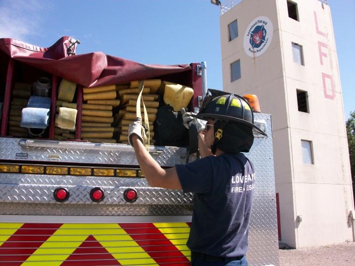 Task #2 Reverse lay. #1 Engine arrives at the fire scene or apparatus needing to be supplied. A firefighter will locate the free end of the LDH including the webbing and hydrant bag (Fig.